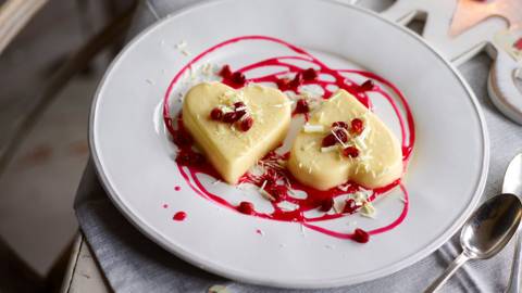 Cream lime heart with a pomegranate sauce